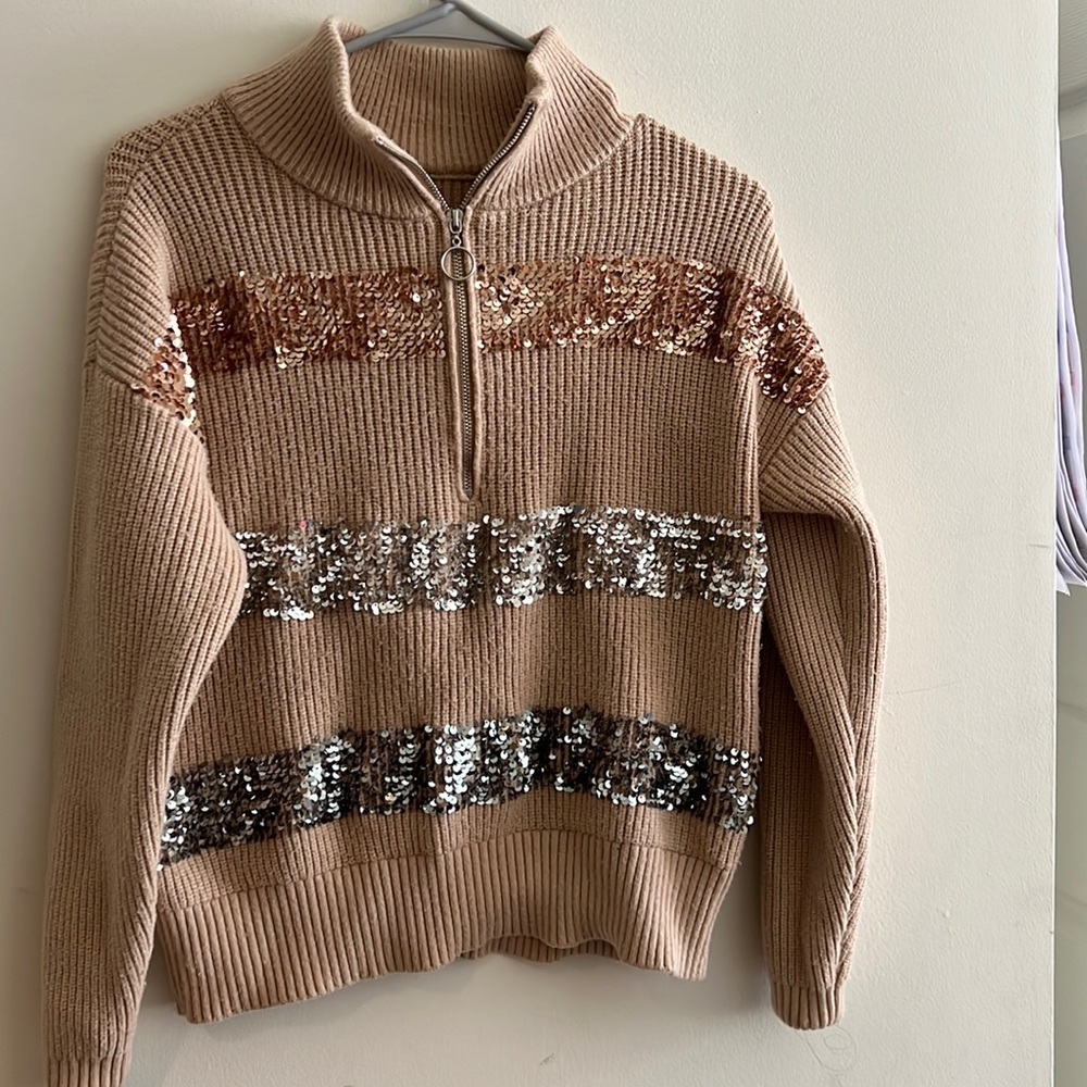 It is a Ninewest brand sweater XS size and hardly one time only used.